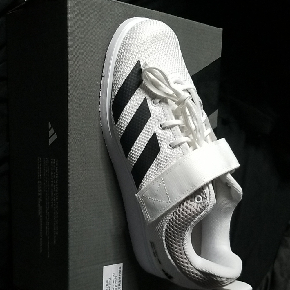 Adidas White and Black Athletic Shoes with Iconic Stripes